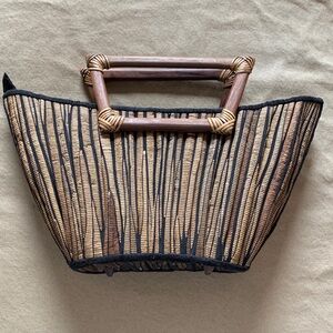 Elegant Tan and Black Woven Handbag